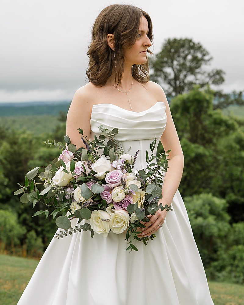 Bride with her bouquet at a hilltop wedding venue in Central Arkansas