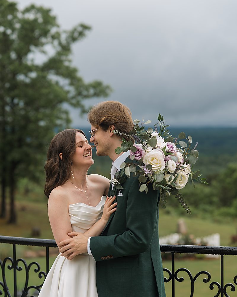 Bride and groom sharing a quiet embrace at a foggy Central Arkansas wedding