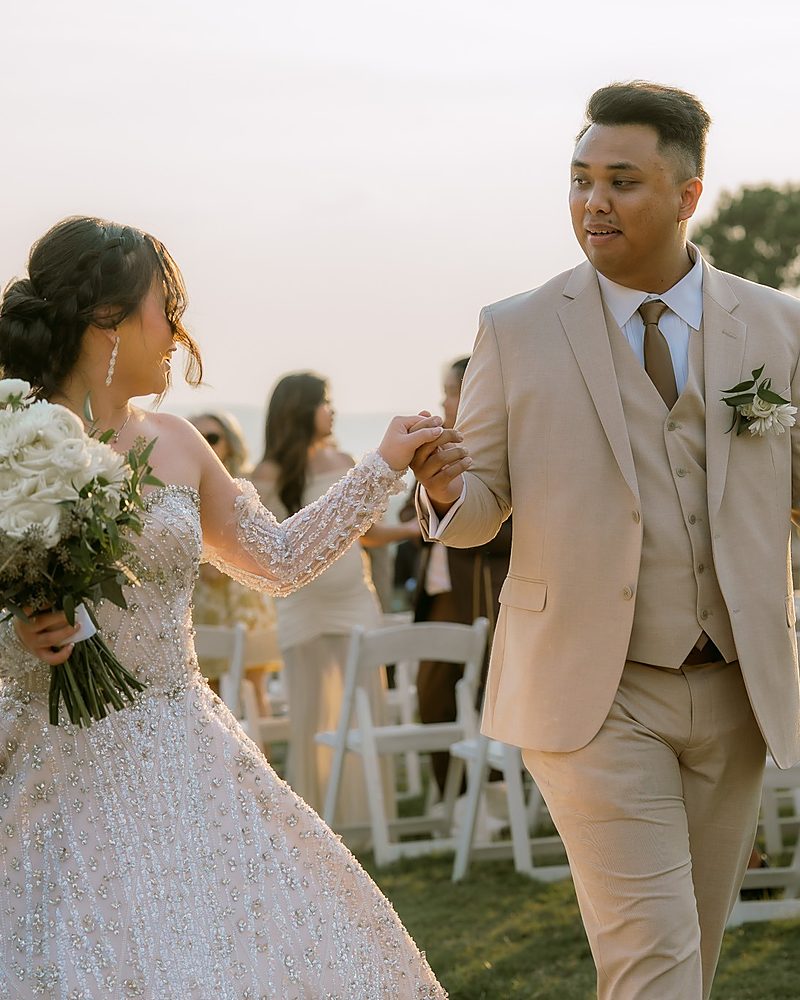 Bride and groom walking at golden hour after their Arkansas wedding
